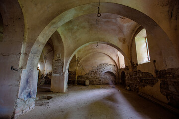 Old vaulted basement under abandoned castle