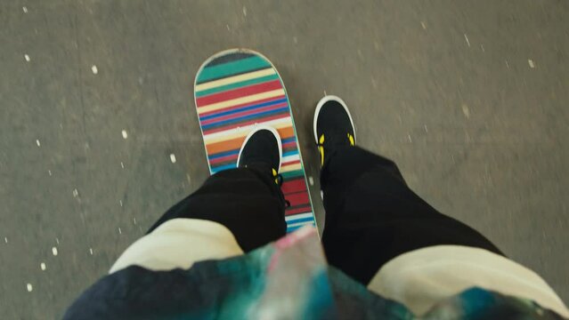 Young skater making jump, performing trick, skateboarder training in skatepark, making tricks, slides and flips, jump over the gap, professional extreme sport athlete ride on skateboard. 