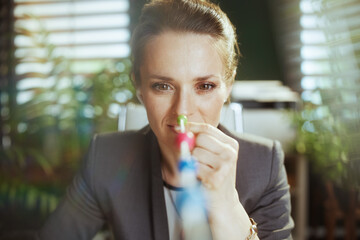 modern small business owner woman at work doing eye exercise