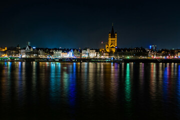 Fototapeta na wymiar promenade Cologne illuminated by bright colored
