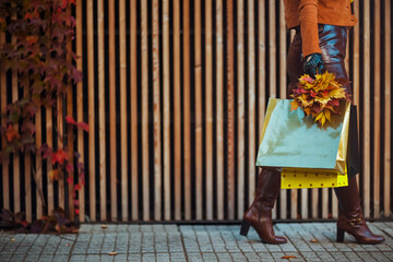 Closeup on modern female in brown trench coat