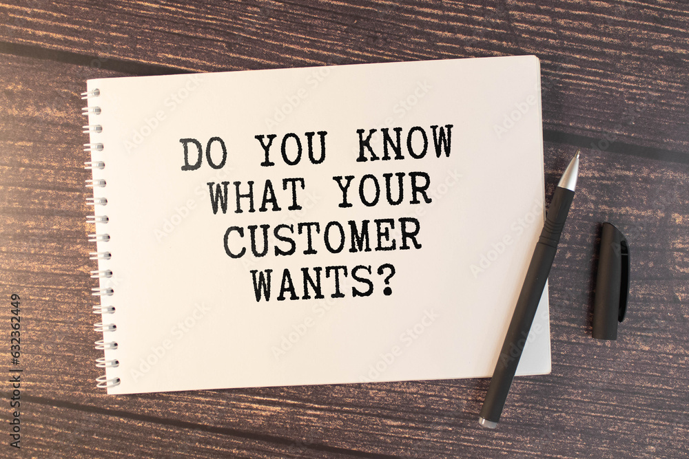 Fototapete notebook with text do you know your customer on a table with sticks, colored paper clips and wrinkle