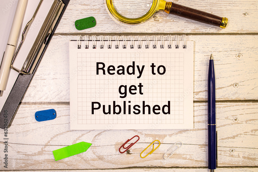 Poster ready to get published text written on notepad with pen on financial documents.