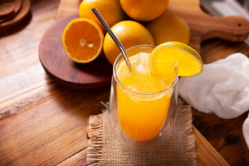 Refreshing homemade orangeade, a natural hydrating drink made from orange juice, very popular in...