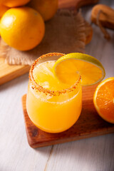 Refreshing homemade orangeade, a natural hydrating drink made from orange juice, very popular in...