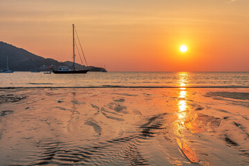 Yachts near the tropical sunset beach - 632367633