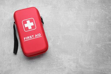 Medicine bag on light gray background, top view with space for text. First aid kit