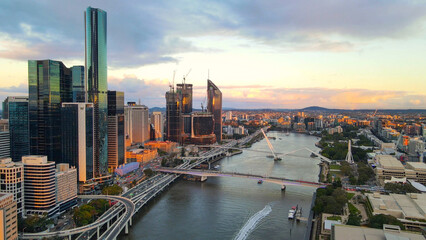 Aerial drone view of Brisbane City, QLD, Australia of the west facing side of the city along Brisbane River and Riverside Expressway during late afternoon in August 2023  - obrazy, fototapety, plakaty