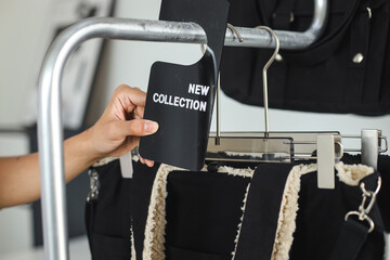 New Collection tag on a clothing rack
