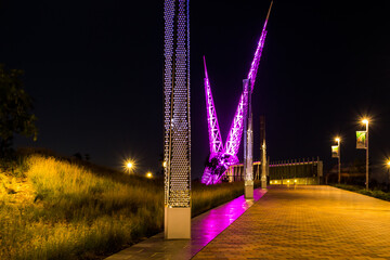 View of the Skydance Bridge in Oklahoma City, illuminated at night