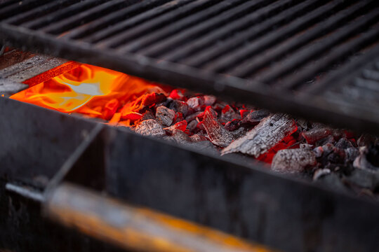 hot coals burning in a fireplace parrilla-type barbecue focusing on the embers
