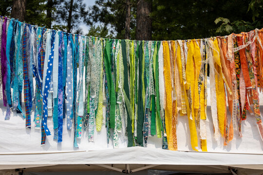 colorful strips of clothes hanging on a rope
