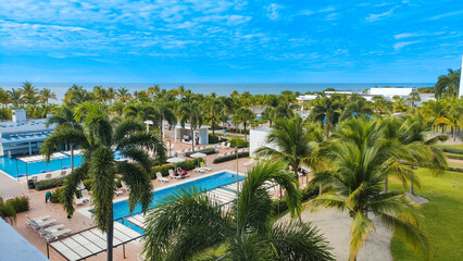 Tropical beach resort hotel. Outdoor tourist landscape. Luxurious beach complex resort and hotel...