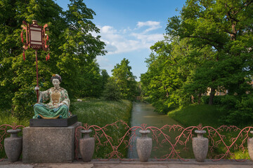 View of the Large Chinese Bridge in Alexander Park in Tsarskoye Selo on a sunny summer day,...