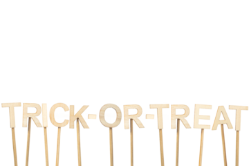 Text: Trick Or Treat. Signboard isolated on a white background made with wooden letters for Halloween. Image with copy space.