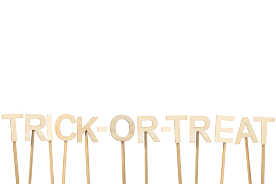 Text: Trick Or Treat. Signboard isolated on a white background made with wooden letters for Halloween. Image with copy space.