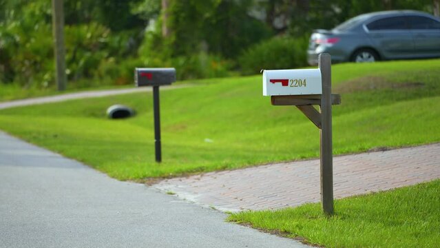 Typical american outdoors mail box on suburban street side
