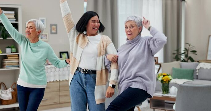 Dancing, senior women and caregiver with wellness, music and freedom with happiness, stress relief and retirement Female people, home or happy group with movement, energy and health in a living room