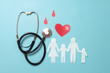 Doctor stethoscope, family and a red heart from paper as a symbol of blood donation for world blood...