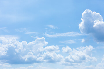 Naklejka na ściany i meble Blue sky on a sunny day. white cumulus clouds