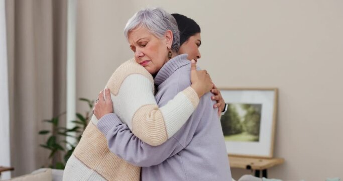 Love, support and empathy with senior friends hugging in a home to console during pain, loss or grief together. Trust, care and unity with elderly women embracing in comfort during retirement