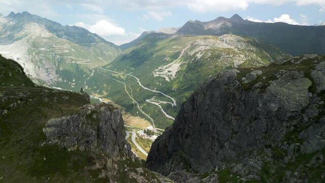 Grimsel Pass  - Winding Mountain Pass Crossing The Bernese Alps In Switzerland. - aerial reveal