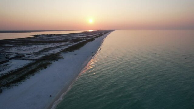 Aerial view of sunrise on the Gulf of Mexico Pensacola Florida Beach on a sunny morning pany out
