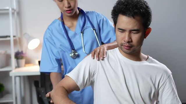 Physician consulting patients about shoulder pain problems ,office syndrome problems, physiotherapy diagnosis concept