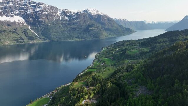 Overlooking Lustrafjorden and Sognefjord - Aerial coming down hillside showing extraordinary landscape and fjord - Looking Southwest towards Gaupne