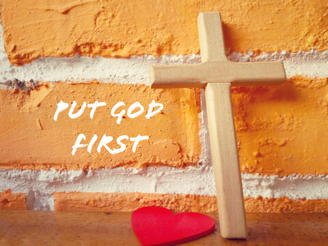 Religion Concept - put GOD first text on brick background.Stock photo.