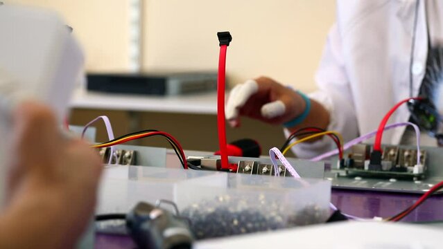 the engineer secures the motherboard to the chassis with screws