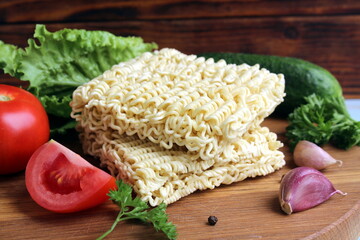 On the table are dry briquettes of noodles.	