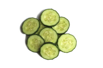 Several slices of cucumber lie on a white background.