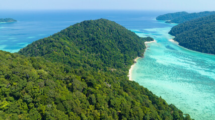 Aerial view with The tropical seashore island in a coral reef ,blue and turquoise sea Amazing nature landscape with blue lagoon © SASITHORN