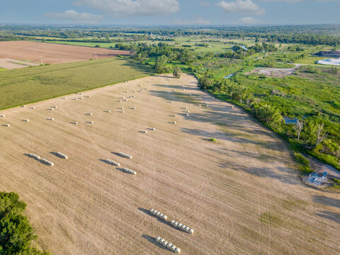 Aerial photo round hay bales Norman Oklahoma farmland landscape