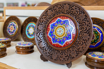 handmade colorful dish, uzbek handmade ceramics, traditional souvenir from Central Asia. Gift shop, Tashkent, Uzbekistan - obrazy, fototapety, plakaty