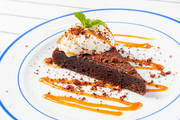 brownie cake with caramel sauce and ice cream