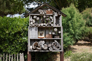 insect house hotel tree wooden hut bug hotel for butterfly bee and animals