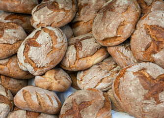 Heap of wholemeal breads in market