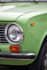 Detail of classic style searchlight  of green Lada car, Retro car exhibition Pécs, Hungary - 23....