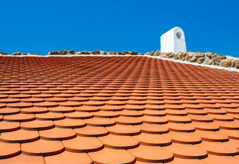 Red tiled roof at blue sky