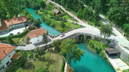 Fototapeta na wymiar Aerial view of Most na Soci (Most na Soči) a town in the Municipality of Tolmin in the Littoral region of Slovenia.