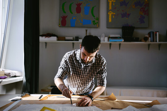 Dressmaker tracing patterns in parlor