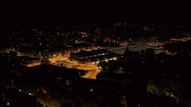 Aerial view of SBB Zurich Hauptbahnhof at night and surrounding illuminated streets. Night cityscape with main train station. Zurich, Switzerland