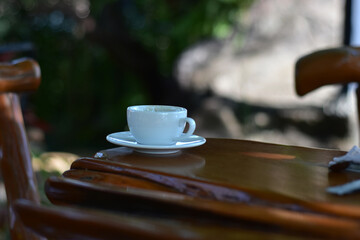 At the cafe, there are tables and chairs for customers to sit.
