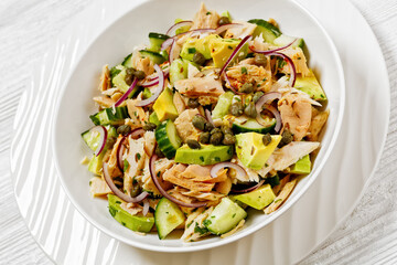 tuna salad with avocado, onion, cucumber, capers
