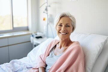 Portrait of beautiful mature adult happy woman sitting in the hospital bed - Powered by Adobe