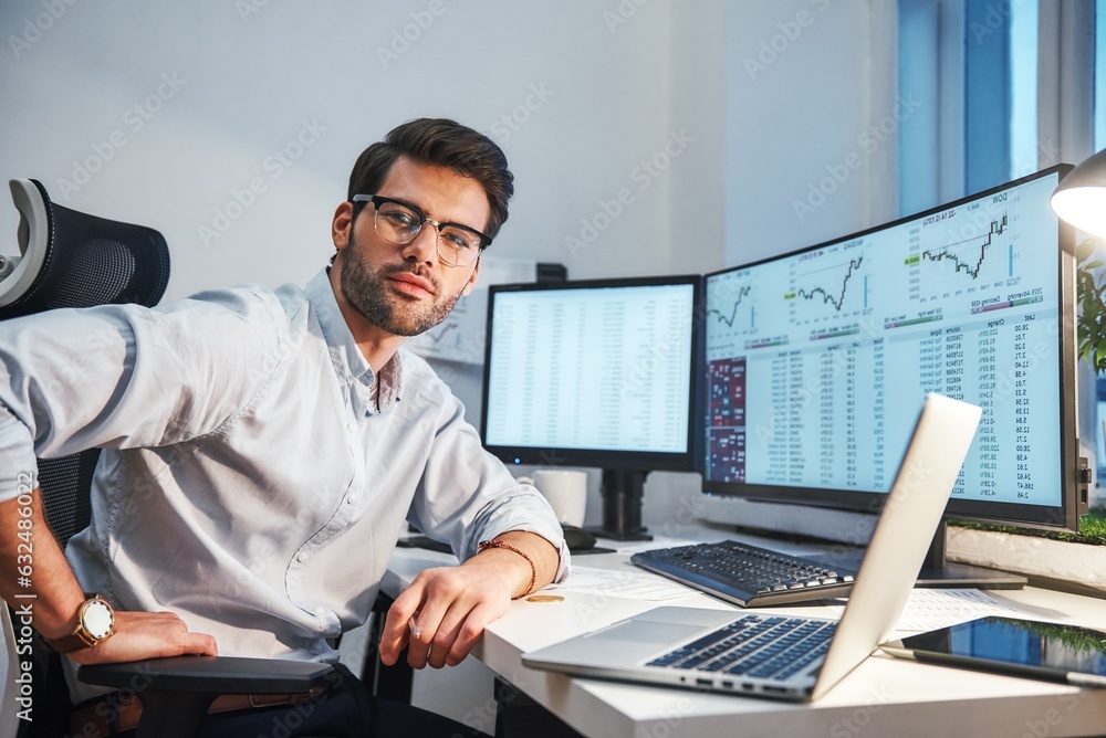 Poster confident and smart. young trader or businessman in eyewear and formal clothes is looking at camera 