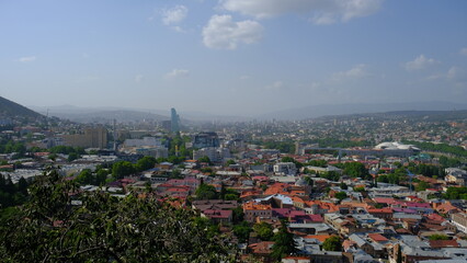 landscape old Town and houses of Tbilisi , Georgia from Above Narikala fort: Holy Trinity Cathedral, Tranquil Lake Views, Peace Bridge Charm, Nmetekhi St. Virgin Church Heritage Zion Cathedral Majesty