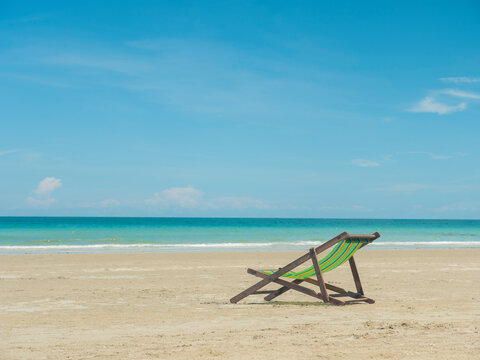 Sun bed chair on empty tropical ocean beach at hat Namsai East of Thailand.